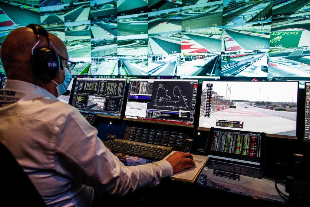 Man sitting in race control for formula 1
